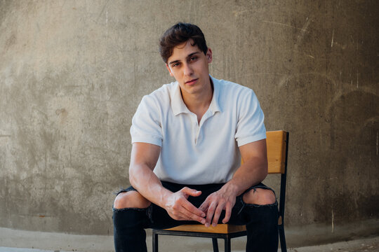 Cool Young Male Model Sitting on Chair 
