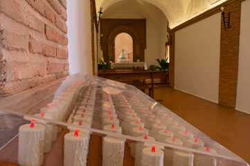Offering of candles inside the chapel of the Sanctuary of the Virgen del Monte.