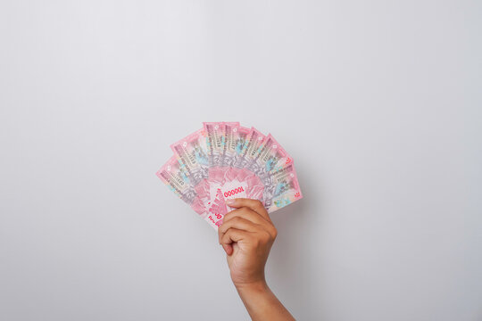 A portrait of new banknotes for Rp.100,000 issued in 2022. Indonesian rupiah currency