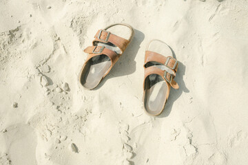 Naklejka premium sandals in sand