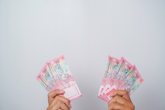 A portrait of new banknotes for Rp.100,000 issued in 2022. Indonesian rupiah currency