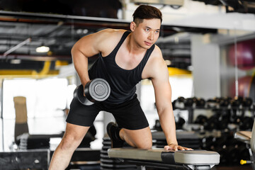 Fototapeta na wymiar portrait Asian man working out in the gym