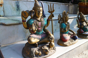 Indian religious figurines are sold in souvenir shops in Rishikesh. Hindu gods Shiva and Ganesha.