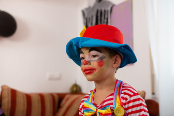Little boy dressed as evil clown for halloween party