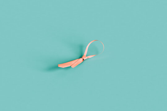 pink tie on a blue background