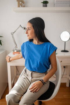 portrait of teenage girl in her bedroom