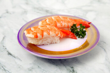 Freshly prepared Japanese food called Ebi or Shrimp Nigiri