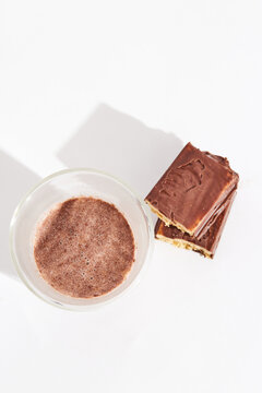 Cup of protein shake and protein bars