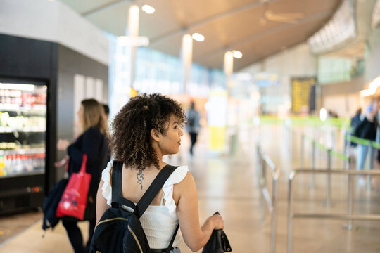 Black woman walking in airport