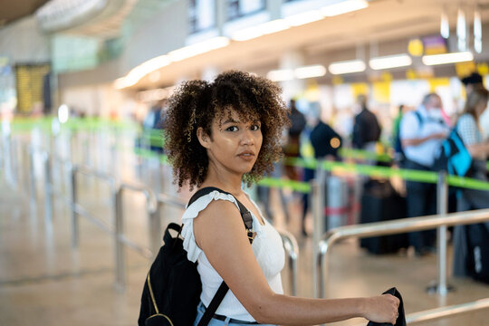 Black Woman Waiting In The Boarding Line