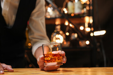 Bartender pouring Whiskey, on  bar,