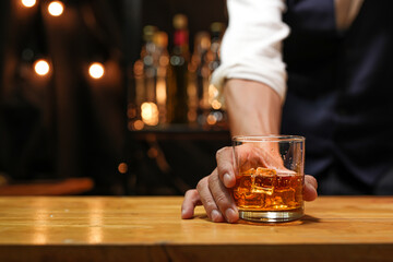 Bartender pouring Whiskey, on  bar,