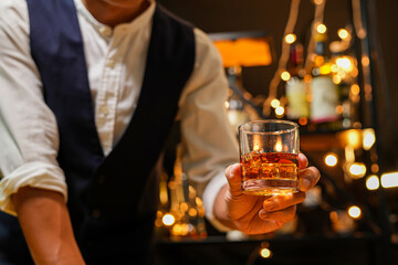 Bartender pouring Whiskey, on  bar,