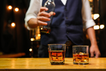Bartender pouring Whiskey, on  bar,