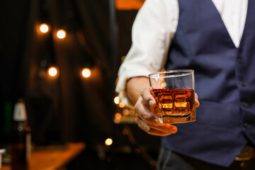 
Bartender pouring Whiskey, on  bar