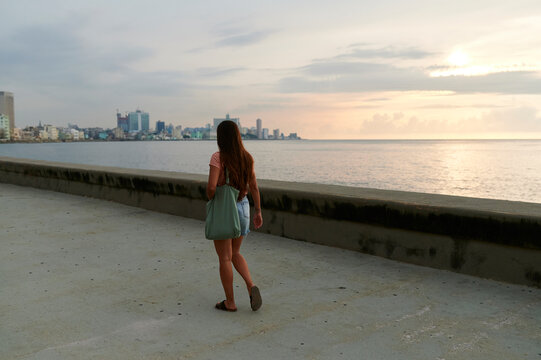 Woman walking along the Malecon