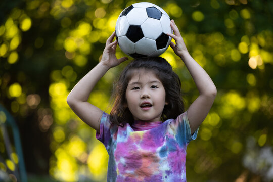 Little girl with soccer ball