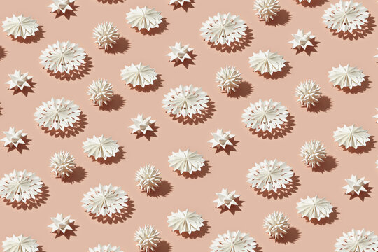White papercraft stars and snowflakes pattern.
