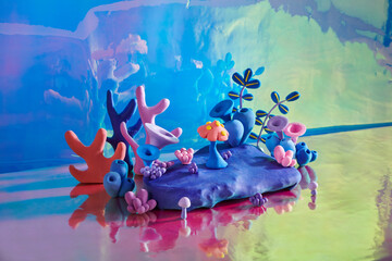 The underwater world with turquoise coral reef, blue seaweeds