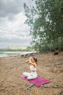 woman practicing yoga in nature