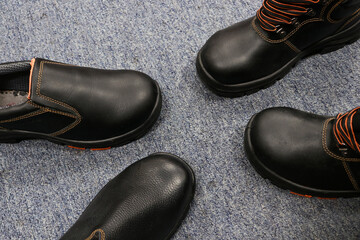 Collection of black leather shoes, usually worn by teenagers