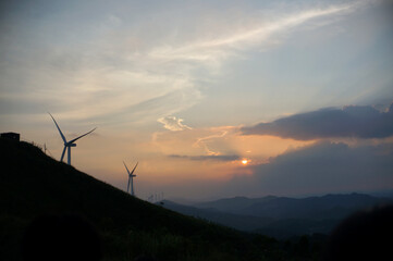 Sunset in the mountains, wind power installations
