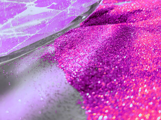 Illuminated vitreous prism in a vibrant purple background.