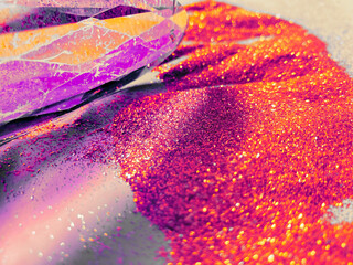 Illuminated vitreous prism in a vibrant golden-purple background.