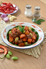 Sambal goreng kentang hati ampela. The chili sauce for fried potatoes ati ampela is a red balado seasoning that is added with candlenut and shrimp paste. Eid al-Fitr menu, served on plate