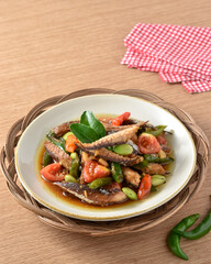 Tumis ikan pindang cue cabai hijau. Practical, fast, and appetizing home recipes. Made from deep-fried tuna and then stir-fried with green chilies, tomatoes, and petai. Served on plate, recipe menu