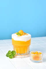 King Mango Thai is a mango juice drink from Thailand combined with whipped cream and yogurt, served with toping sliced mango. This drink is booming in Indonesia, because healthy and low fat