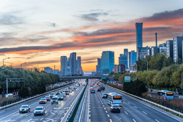 In the evening, the core area of Beijing's CBD is at the peak of sunset clouds and traffic flow