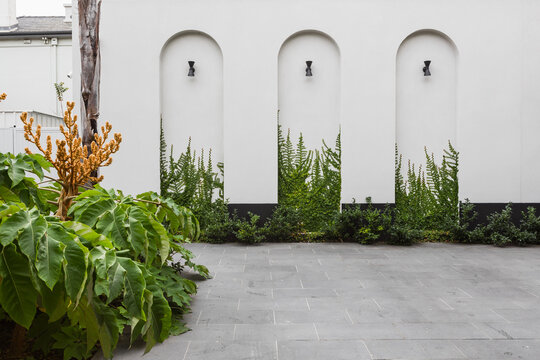 Three architectural feature arches on a home facade
