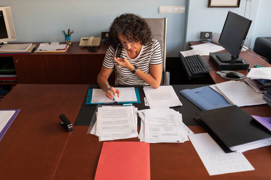 Woman on the phone with a client