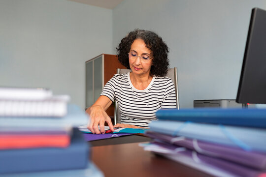 Woman working with files in an office