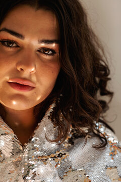 Pretty woman with sequin cape portrait
