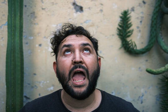 man making a surprised or frightened face 