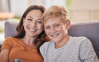 Love, family and portrait of mother and child on a sofa, happy and smile while bonding, embrace and laughing together. Mom, son and happy family moment in a lounge, enjoying quality time in Amsterdam