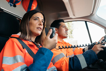 EMs Paramedic with Radio in Ambulance