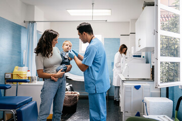 Pediatric doctor examining little patient