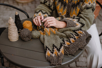 Woman knitting sweater
