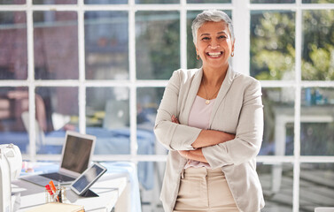 Mature business woman, portrait and arms crossed, leadership and confidence in modern office. Happy...