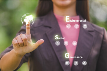 ESG icon concept in the hand for environmental, social, and governance in sustainable and ethical...