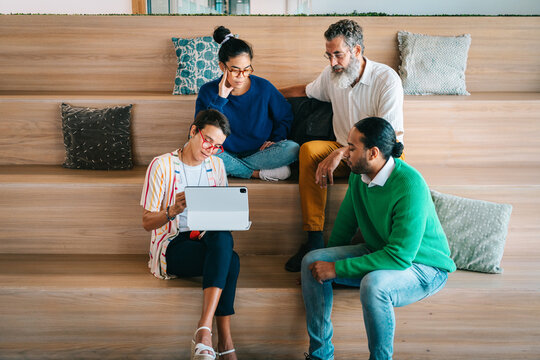 Group of colleagues having a meetup in creative co-working space