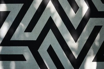 Black and white line shapes painted on wall