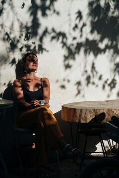 Turkey vibe, woman drinking coffee in the street cafe