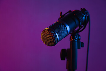 microphone in a studio with colored lights