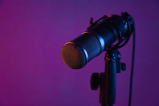 microphone in a studio with colored lights