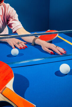 Stylish hands on tennis table.