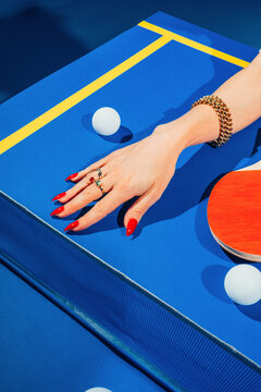 Female hand on table tennis
